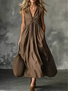 Full-body view of a brown sleeveless V-neck maxi dress with a pleated waist design
