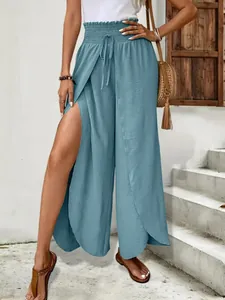 Elegant light blue high-waisted wide-leg pants featuring a stylish side slit design