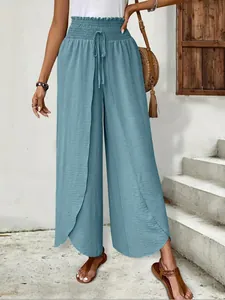 Elegant light blue wide-leg pants with stylish front slit and elastic waist detail