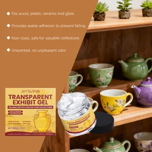 Transparent exhibit gel being used to secure delicate ceramic cups on a wooden shelf