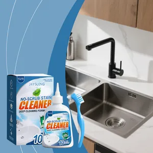Kit de limpieza multiusos JAYSUING con botella, caja y cepillo en un fregadero de cocina