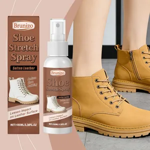 Professionele Brunizo schoenoprekker spray fles en doos naast bruine leren laarzen getoond.