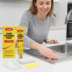 Vyreth metal polishing paste being applied to a stainless steel kitchen sink for cleaning