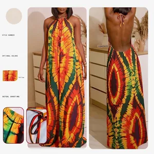 Bohemian halter backless maxi dress with vibrant tie-dye print and adjustable neck ties