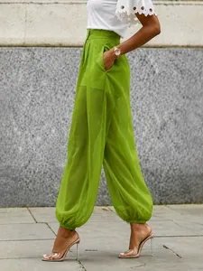 Chic green high-waisted mesh sheer lantern pants for a bold summer look