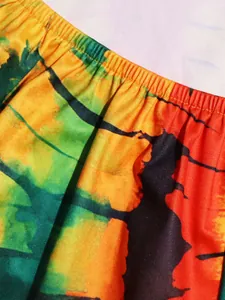 Detailed close-up view of vibrant bohemian printed fabric featuring elasticated gathers.