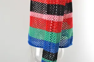 Macro view of the hollow-out knit texture and rainbow stripes on this beach cover-up.