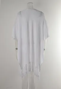 Back view of a white hollow knitted beach cover-up with fringe tassels on clear mannequin