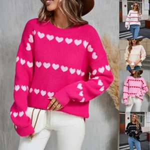 Variety of colorful women's heart pattern knitted sweaters in pink, black, and white styles