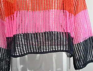 Macro detail view of a rainbow striped hollow-out crochet knit summer cover-up top.