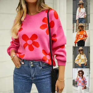 Detail view showing multiple color options of the heart and floral knit sweater