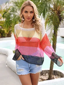 Vibrant rainbow striped crochet hollow-out knit cover-up top on model for vacation