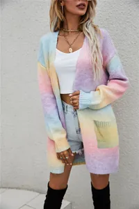 Detailed close-up view of a rainbow tie-dye loose knitted cardigan with side pockets.