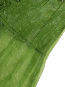 Detailed macro view of the sheer green mesh fabric showing texture and transparency