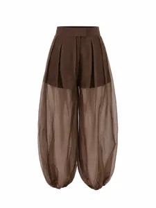 Detailed view of brown high-waisted mesh sheer lantern pants with voluminous silhouette