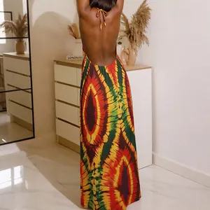 Bohemian backless halter maxi dress featuring a vibrant eye-shaped tie-dye print design