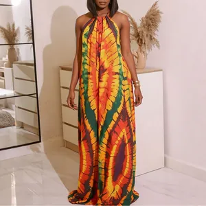 Vibrant Bohemian halter maxi dress with bold colorful tie-dye print for summer vacation.