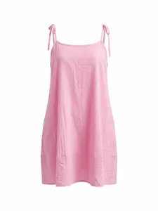 Close-up view of a pink summer babydoll dress with adjustable tie-up shoulder straps.
