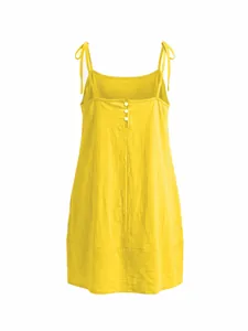 Detailed view of a yellow tie-shoulder summer dress featuring a square neck and button back