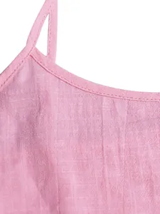 Close-up of pink linen-blend fabric and square neck strap detail on a summer camisole dress.
