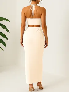 Back view of elegant off-white two-piece halter crop top and crinkle maxi skirt set