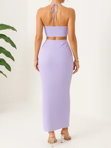 Back view of a lavender crinkle halter crop top and maxi skirt set for a summer vacation