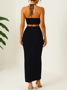 Back view of elegant black pleated two-piece set featuring halter top and maxi skirt