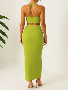 Back view of a lime green two-piece set featuring a crinkled texture halter top and skirt.