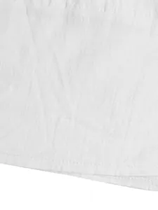 Detailed macro shot of white breathable cotton linen fabric texture with neat stitching