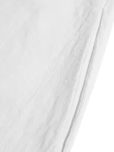 Detailed macro view of white breathable linen fabric texture for summer vacation dress