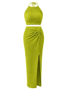 Detailed view of lime green pleated two-piece set with halter top and slit skirt.