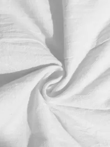 Detailed macro view of white cotton linen fabric texture for summer A-line dress