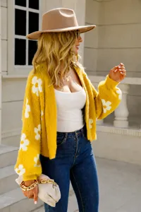 Stylish short yellow knit cardigan with white floral patterns for street style fashion