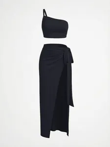 Sexy black two-piece set featuring one-shoulder crop top and high-slit long skirt