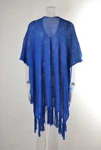 Detailed rear view of a blue hollow-out crochet beach cover-up with elegant long tassels
