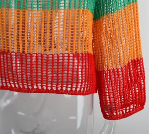 Detailed macro view of a colorful rainbow striped crochet cover-up with hollow out knit.