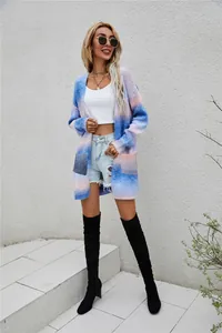 Stylish model posing in a colorful rainbow tie-dye long-line knit cardigan sweater