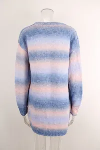 Back view of a cozy oversized knitted sweater with blue and pink rainbow gradient.