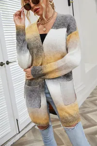 Detail shot of a long-sleeved tie-dye cardigan with soft gradient yellow and grey tones