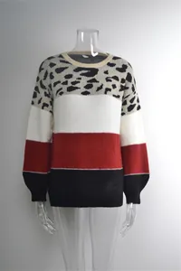 Detail of women's color-block knit sweater with bold leopard print and round neck collar