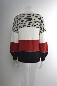 Back view of leopard print color-block knit sweater with red, black and white stripes.