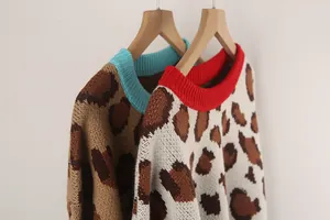 Detailed view of women's leopard print knit sweaters with colorful ribbed collars