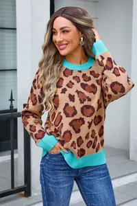 Stylish leopard print knit sweater featuring vibrant blue ribbed collar and cuffs trim.