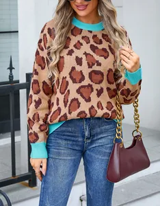 Detailed view of women's leopard print knit sweater featuring vibrant blue ribbed trim