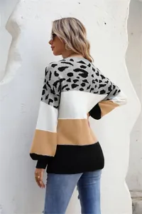 Back view of a chic leopard print color block sweater featuring a knit texture design