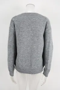 Back view of a cozy gray knitted sweater featuring a crew neck and ribbed details