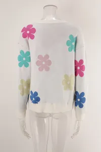 Back view of white round neck knit sweater featuring vibrant colorful floral patterns and rib trim