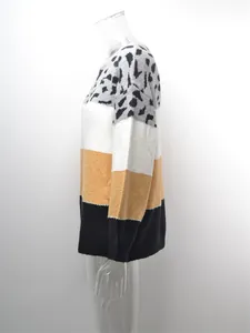 Side profile of a women's oversized color block leopard print knit sweater pullover