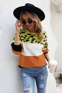 Chic color-block knit sweater featuring leopard print, white and rust orange stripes design
