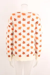 Back view of white crew neck knit sweater with orange and brown maple leaf pattern